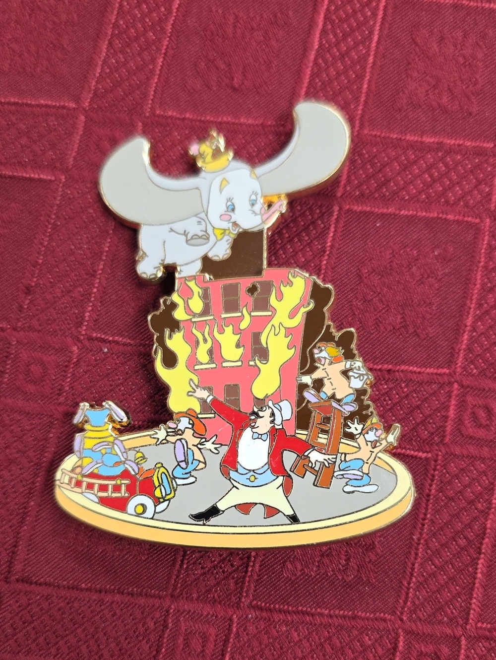 Disney Dumbo White & Gold Enamel Pin with Red and Yellow Fire Scene